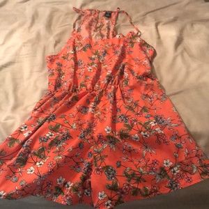 Orange romper with flowers